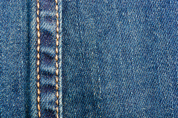 clothing items blue stonewashed faded jeans cotton fabric texture with seams, clasps, buttons and...