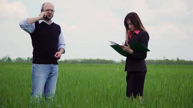 Farmer has unpleasant conversation on phone with agronomist because of false documents in accounting Department and solves this problem with business woman