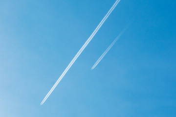 Aircraft flying high in the sky. Blue clear sky