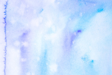 watercolor background filled blue with drips of paint spread over the paper. on textured watercolor paper paint