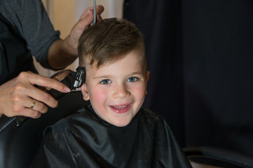 Little blue hair boy at hair salon