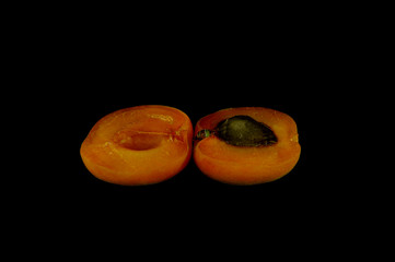Apricots on a black background close-up