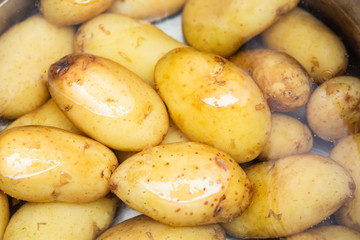 jersey royal potatoes in a saucepan full of water