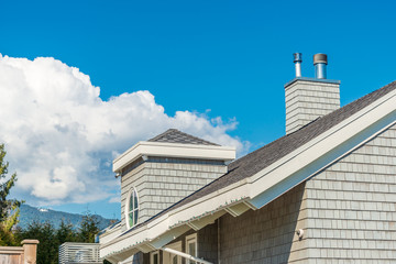 The top of the house or apartment building with nice window.
