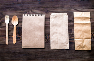 Take away set with paper bags on restourant table background top view