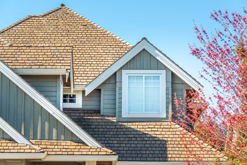 The top of the house or apartment building with nice window.