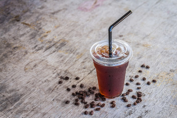 Iced americano black coffee on old a wooden desk