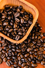 Coffee Beans In A Wooden Bowl On Rich Wood Background