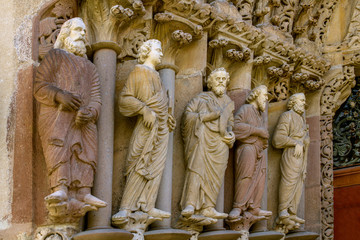Obraz premium Statues of apostles of unique portal Porta Coeli. Monastery of Porta Coeli. Gothic portal Romanesque-Gothic Basilica of the Assumption of the Blessed Virgin Mary. Built in 1230. 