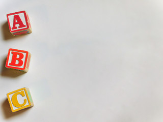 ABC wooden blocks to the left