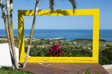 View of Caribbean Ocean through yellow frame