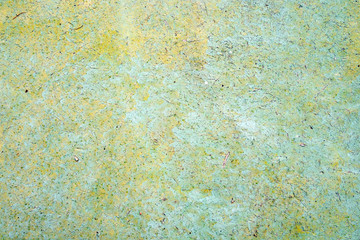 old painted cracked background, textured wall of green, yellow and blue colors