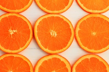 Slices of orange on white background. Flat lay, top view.
