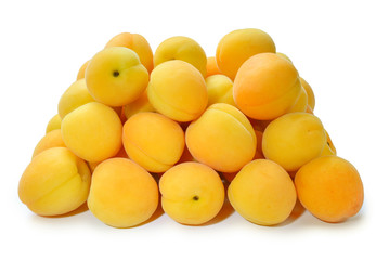 Ripe juicy orange apricots isolated on white background.