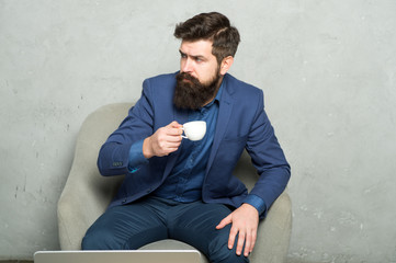 Coffee break concept. Business people. Best coffee served for him. Attractive pensive manager in thoughtful mood. Coffee cup. Recharge and reload. Man handsome bearded businessman hold cup of coffee