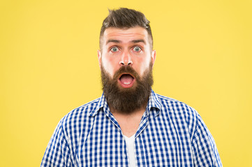 Wondering every time. Man bearded hipster wondering face yellow background close up. Guy surprised...