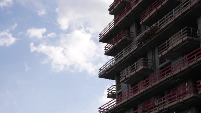 Building Frame Exterior and Sunny Sky