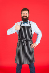 Giving his approval. Bearded man giving thumbs up approval hand gesture. Hipster gesturing approval sign. Cheerful cook or barista expressing his approval to meal or cocktail