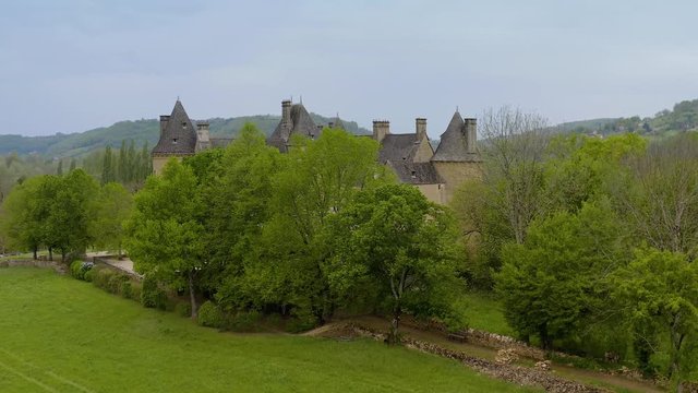 Landscape with Castle of Montal surrounded by green meadows, trees  also a expendid a garden