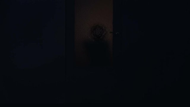 Little child ghost standing outside door of abandoned house paranormal phenomena