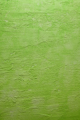 Green uneven surface of the plastered wall - background or texture