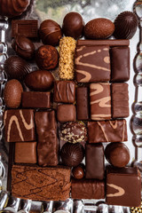 Сhocolate candy set. Lots of various sweet candies. Sweet desserts on a tray. Top view.