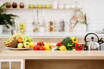 Fresh Vegetables And Fruits On Kitchen Table