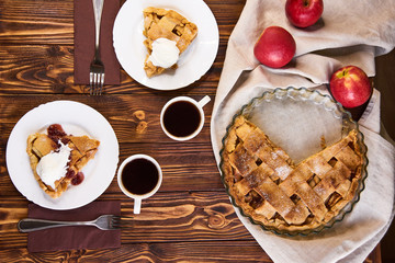 Homemade apple tart. Served table for two. Traditional dessert for Independence Day in America. Rustic style. Top view