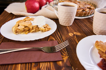 A finished plate and spoon, after eating apple pie a la mode. Part of a series of images showing the preparation of traditional apple pie.
