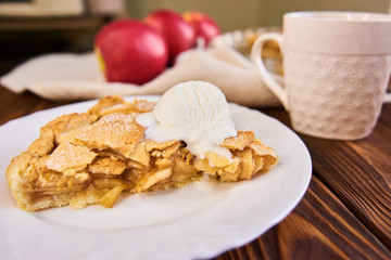 A finished plate and spoon, after eating apple pie a la mode. Part of a series of images showing...