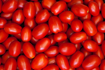 Fresh red plum tomatoes on the market.