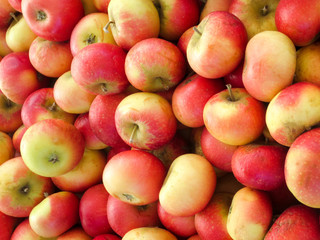 Fresh red yellow apples on the market.
