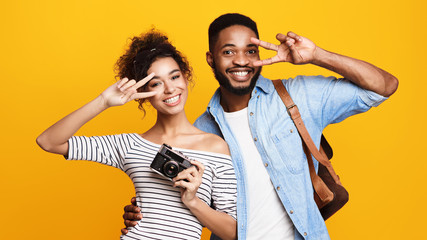 Young Couple Ready For Trip, Orange Background