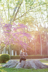 Woman meditating in a park.