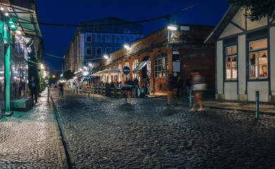 Long exposure of people at the LX Factory, Lisbon, Portugal