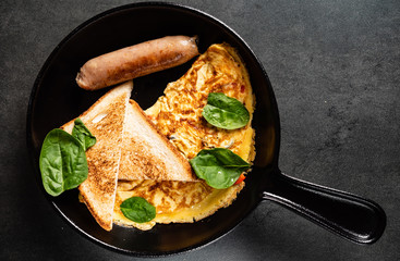 omelet with toasts and sausage