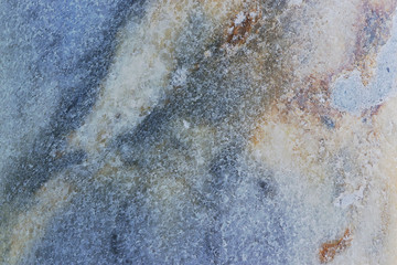 Natural marble background, natural natural texture of an ancient stone. It is used for finishing buildings and embankments, a fine background for a desktop and for photodesign