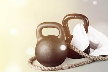 Kettle bells, rope and towel isolated on white