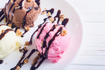 Ice cream with walnuts and chocolate topping