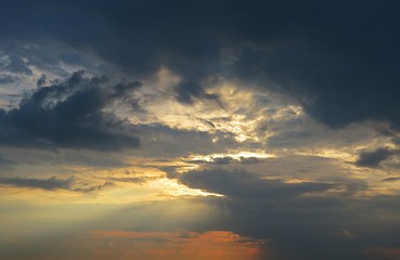 Dark dramatic clouds in the sky at sunset, natural cloudscape