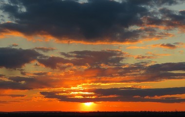 Beautiful fiery red sunset in the sky, natural cloudscape