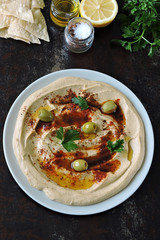 Fresh hummus with olive oil and spices.