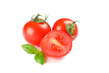 Fresh cherry tomatoes with basil isolated on white background. Ripe vegetables