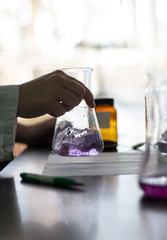 Mixing chemicals in a research lab chemistry science biology biochemistry