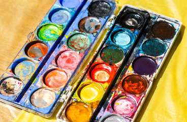 Different used colorful watercolor paint
