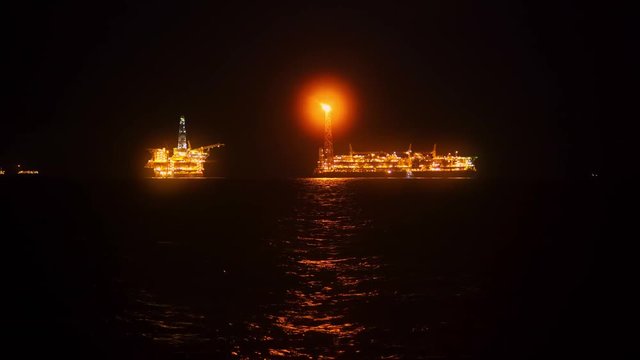 FPSO tanker vessel near Oil platform Rig. Offshore oil and gas industry, sea oil production and storage.