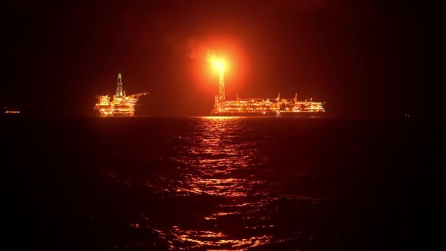 FPSO tanker vessel near Oil platform Rig. Offshore oil and gas industry, sea oil production and storage.