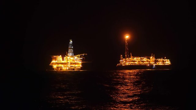 FPSO tanker vessel near Oil platform Rig. Offshore oil and gas industry, sea oil production and storage.