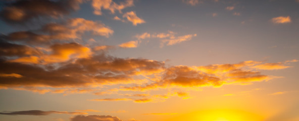 Naklejka na ściany i meble Colorful panorama sky during sunset in the twilight sky.