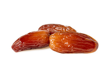 Sweet dates fruit or three dried dates isolated on white background